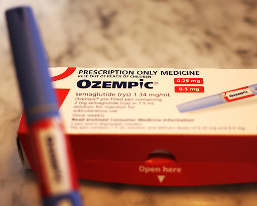 Prescription box and injection pen of Ozempic (semaglutide) shown on a countertop, highlighting the medication used for diabetes and weight-loss treatment.